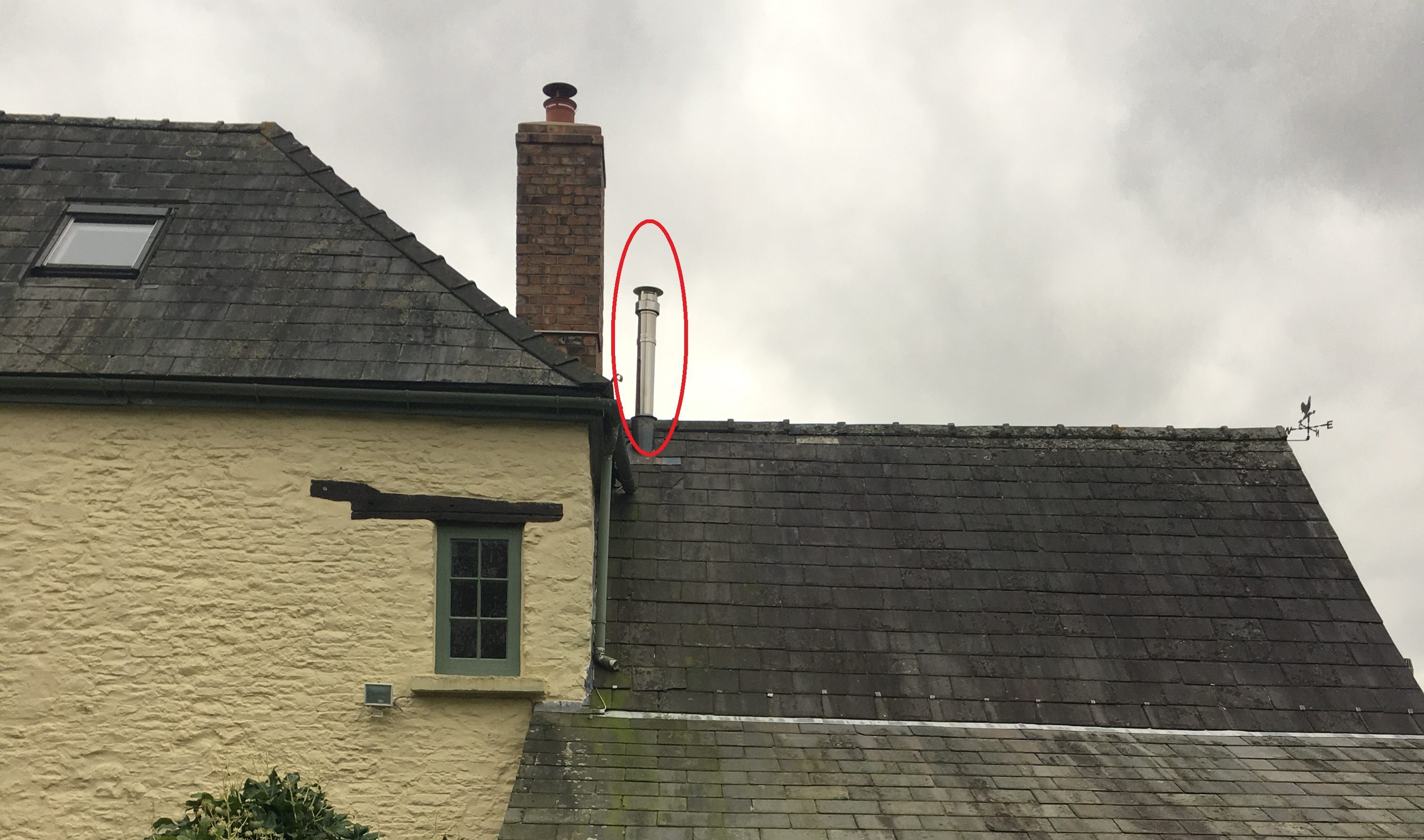 Low chimney height when in close proximity to higher roofs and chimneys